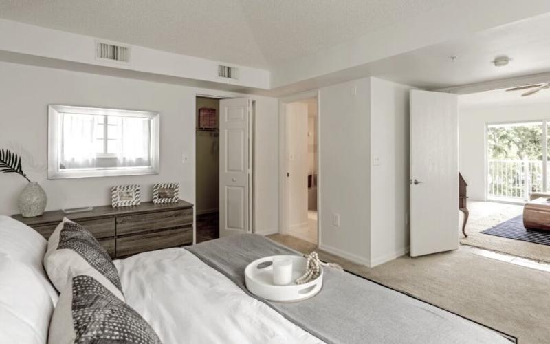 a bedroom with a bed and a dresser