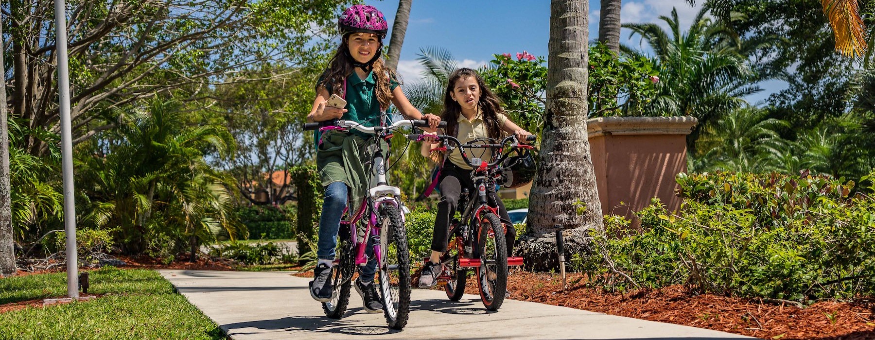 a couple of girls riding bikes