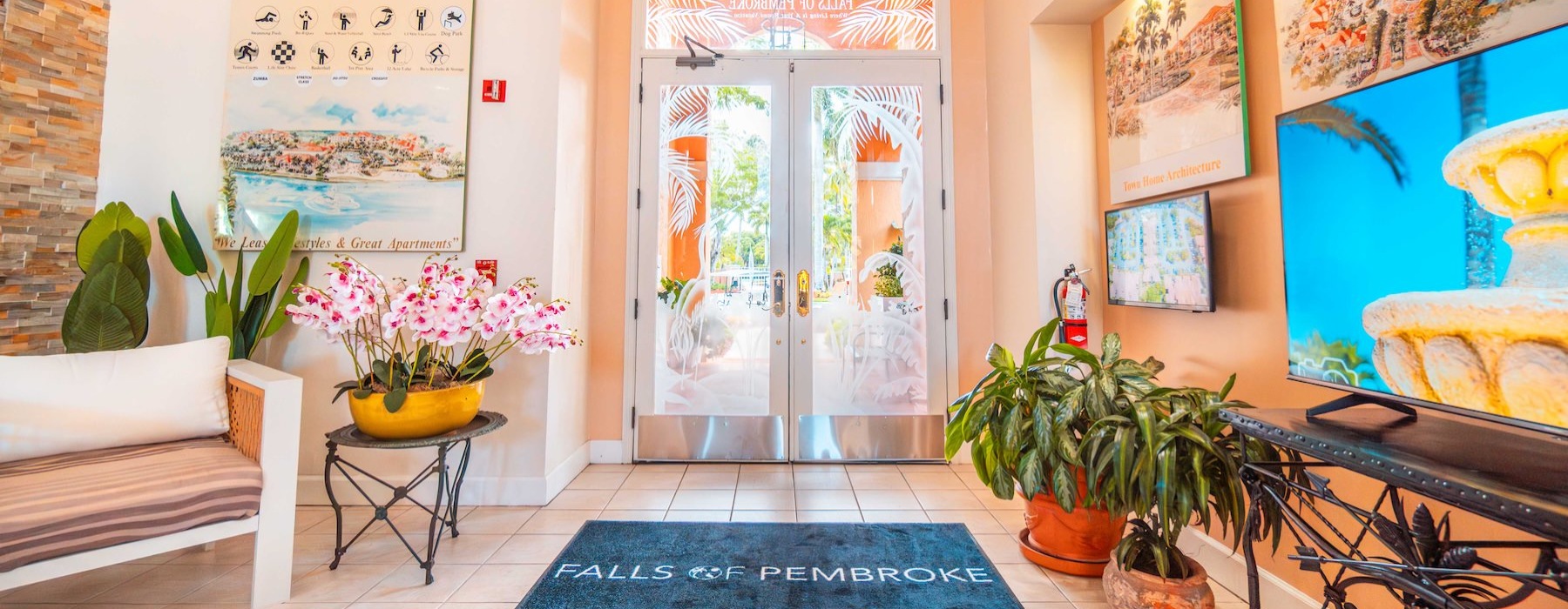 an entrance with a couch and a tv