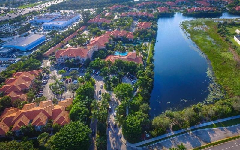 an aerial view of a city with a body of water